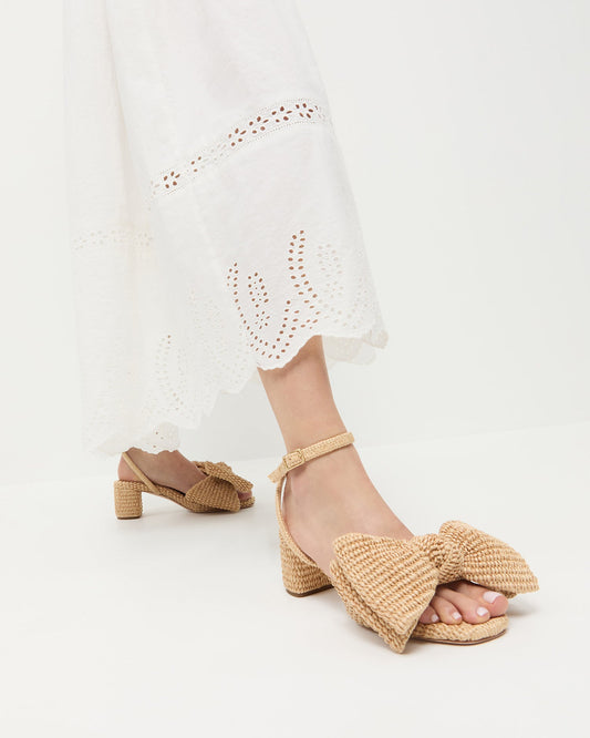 Carmen Natural Bow Sandal in natural raffia and Thelma Eyelet Dress in cream cotton.