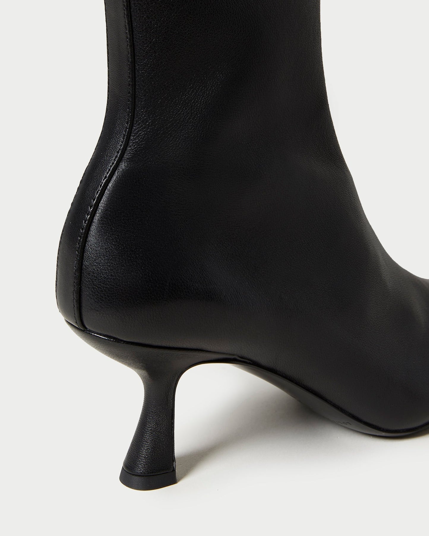 Thandy Black Leather Curved Heel Bootie