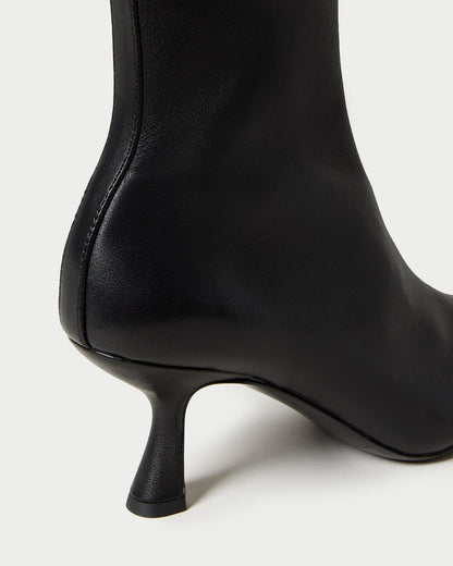 Thandy Black Leather Curved Heel Bootie