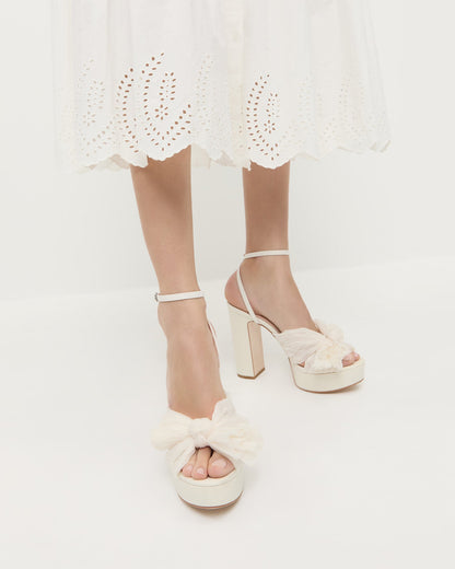 Natalia Pearl Platform Bow Heel in pearl organza fabric and Thelma Eyelet Dress in white cotton.