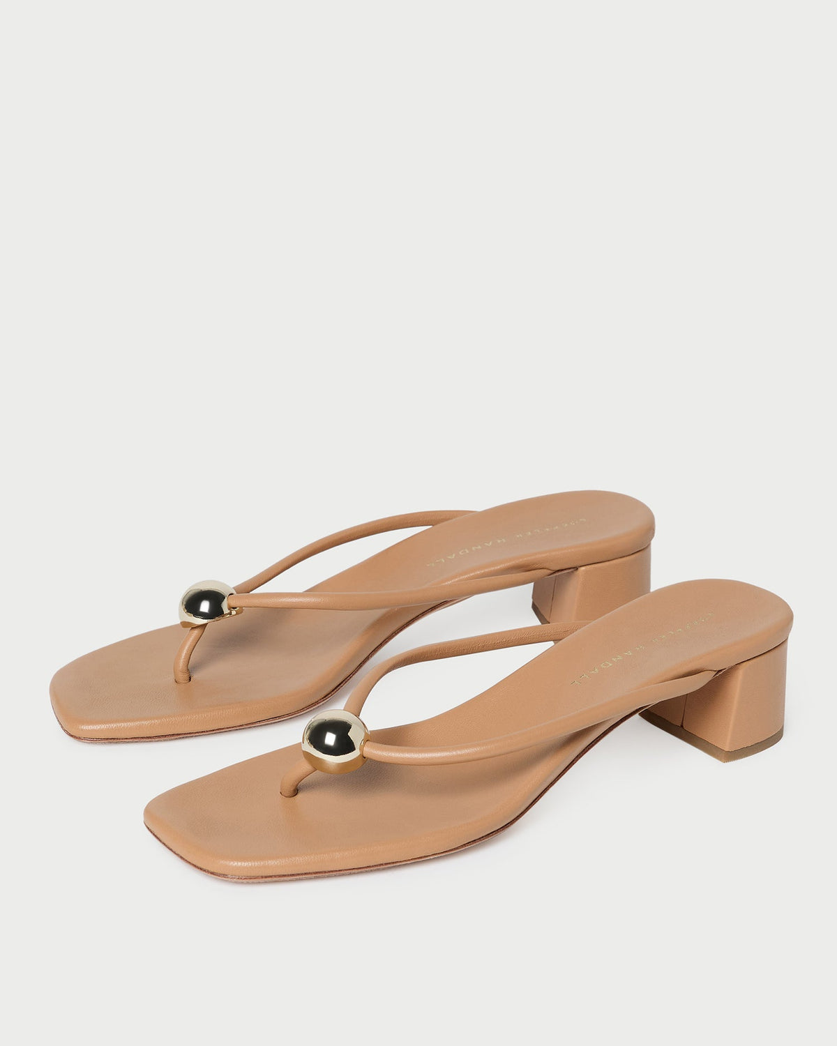 Odessa Dune Leather Heeled Sandal in dune tan leather with a gold ball accent.