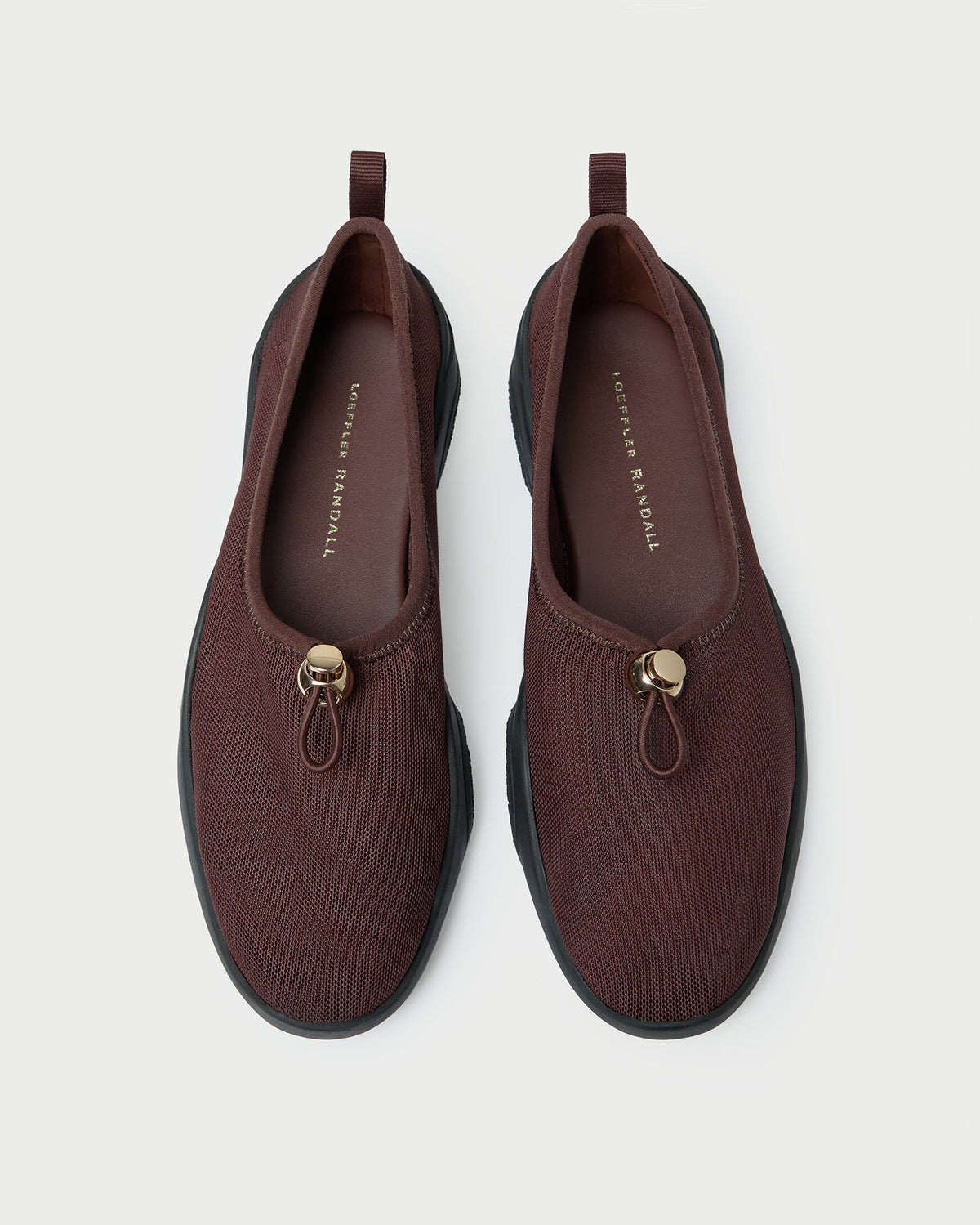 Raina Dark Brown Mesh Flat in dark brown mesh.