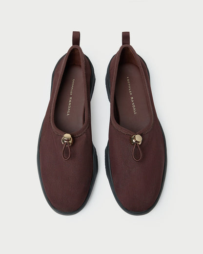 Raina Dark Brown Mesh Flat in dark brown mesh.