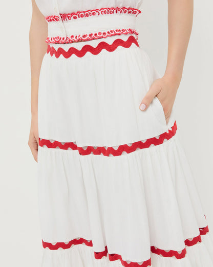 Aimee Skirt in white cotton with red accents and Veda Top in white cotton with red accents.