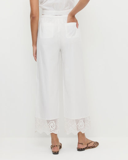Amani Pant in white cotton and Devon Leopard Slingback Sandal.